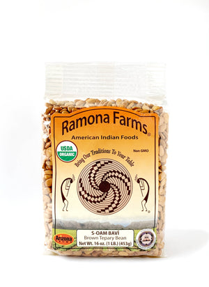 A white background with a package of White Teppary Beans (S-TOTOAH BAVÍ) from Ramona Farms.