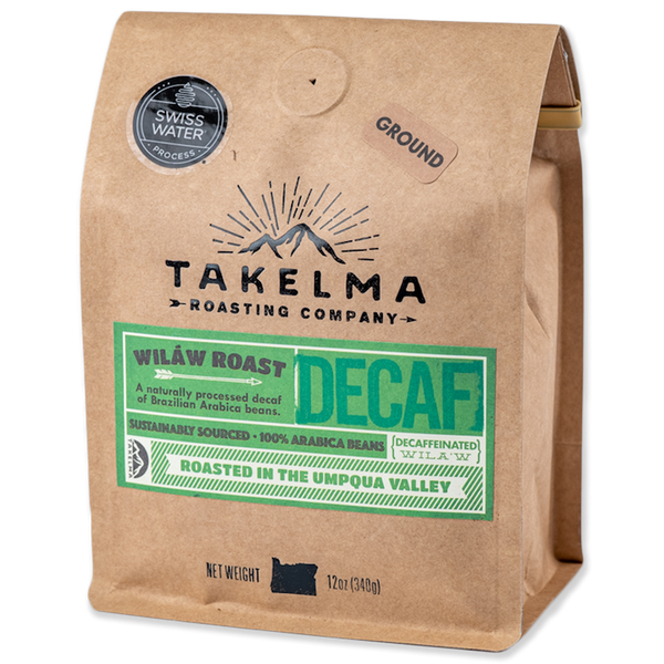 A 12 oz light brown bag of ground, decaf (swiss water process) coffee from Takelma Roasting Co.