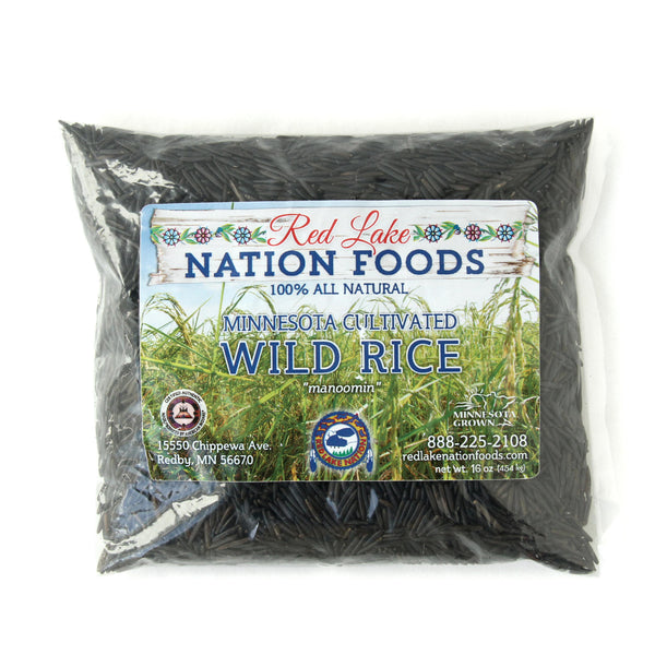 A package of Minnesota Cultivated Wild Rice (manoomin) from Red Lake Nation Foods on a white background.